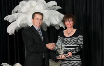 Lifetime Achievement Award in 2013 went to Michaud & Levesque TRU Hardware. Above are Paul Levesque be presented by the Mayor of West Nipisisng, her Honor Joanne Savage. 